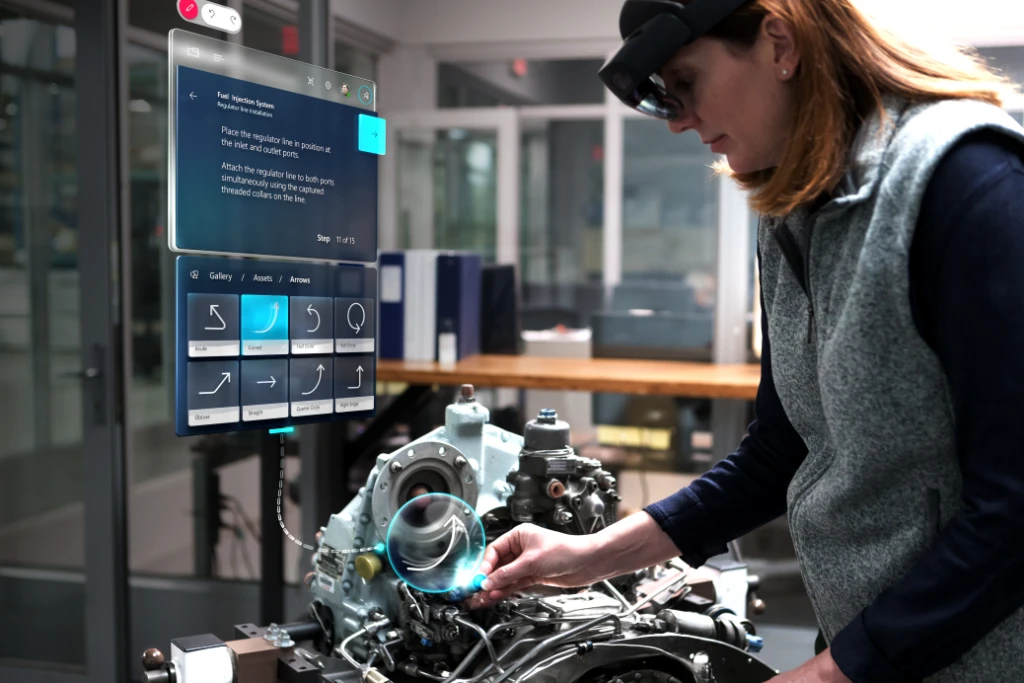 Woman using Dynamics 365 Guides with implied motion to assemble an engine.