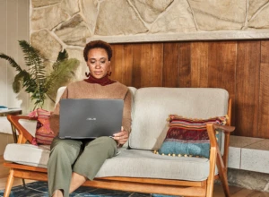 Woman interacting with an Asus laptop.