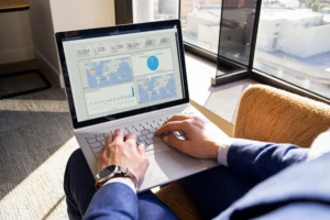 a man with laptop showing Dynamics 365 sales