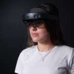 A picture of Melissa wearing a Microsoft HoloLens