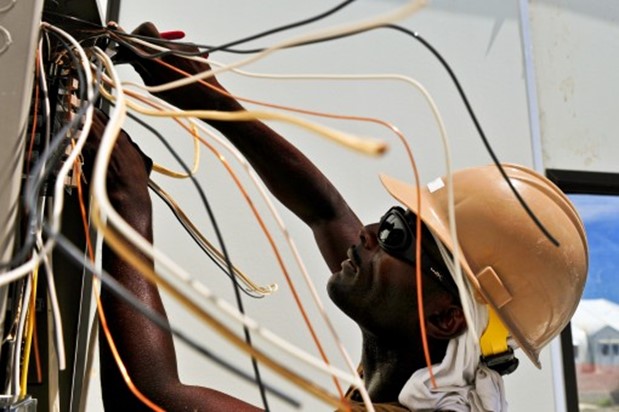 Man working with wires.