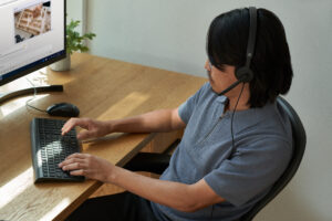 Photo of male IT admin checking for Exchange Online Basic authentication.