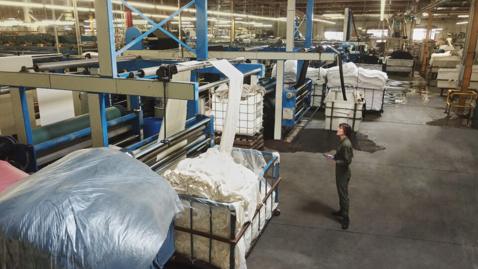 Photo of a worker taking inventory in a warehouse.