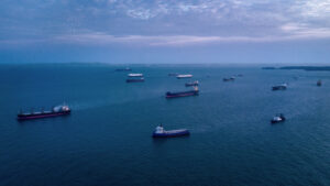 Photo of container ships waiting to dock in Singapore harbor.