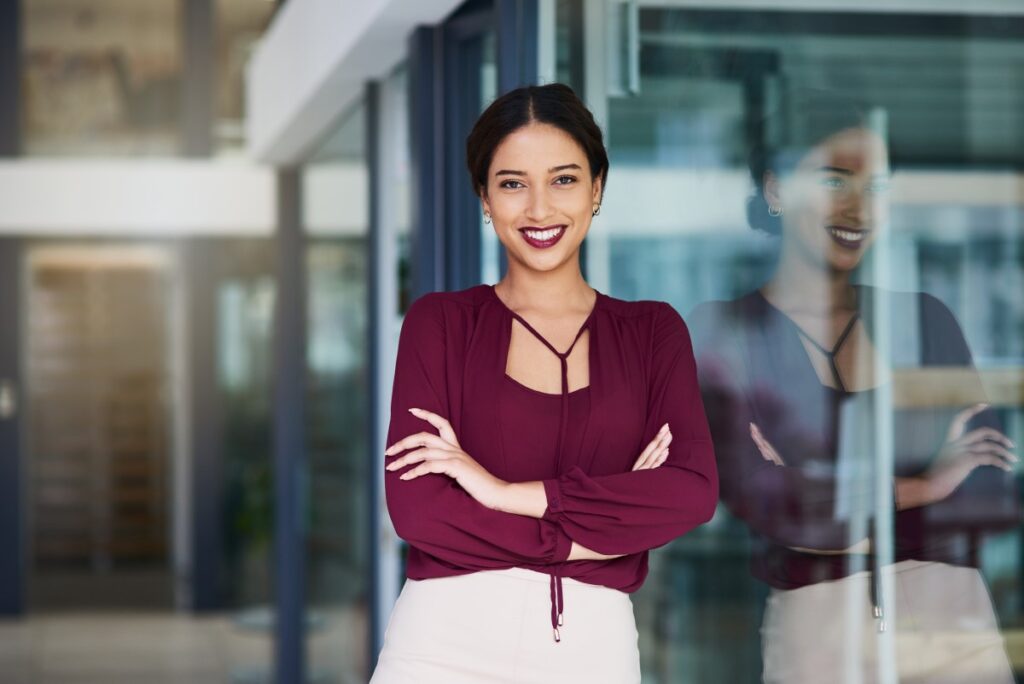 Portrait of a woman standing in a modern office building