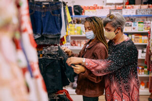 Mother and daughter shopping for clothing.