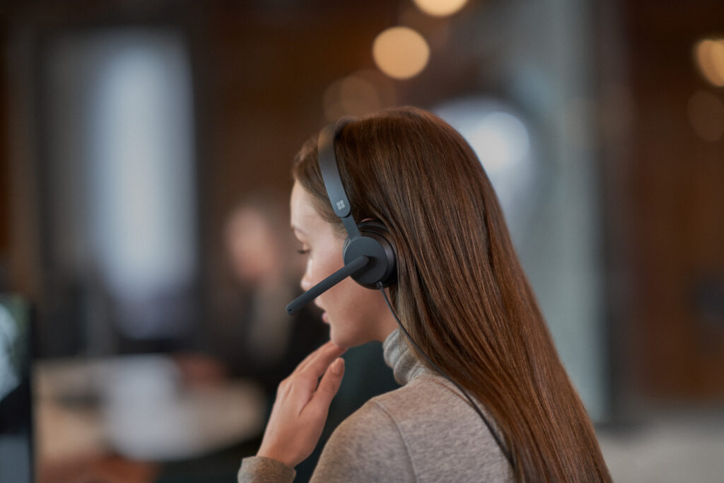 Dynamics 365; operations; woman; wearing headset; taking a phone call