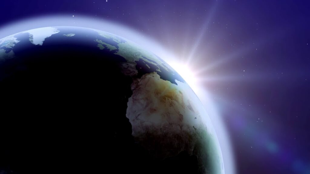 Cropped picture of the earth with the sun behind it