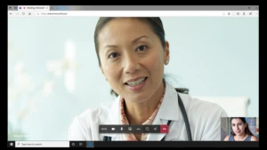Photograph of a female physician speaking to a patient using the video conferencing features in Microsoft Teams