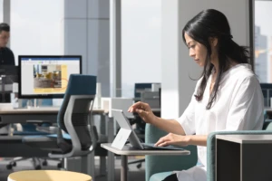 Image of a woman using a Surface in an office.