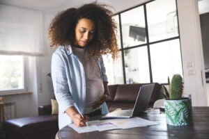 Business pregnant woman working from home