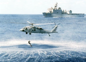 Sikorsky MH-60S Knighthawk retrieving soldier from Atlantic Ocean