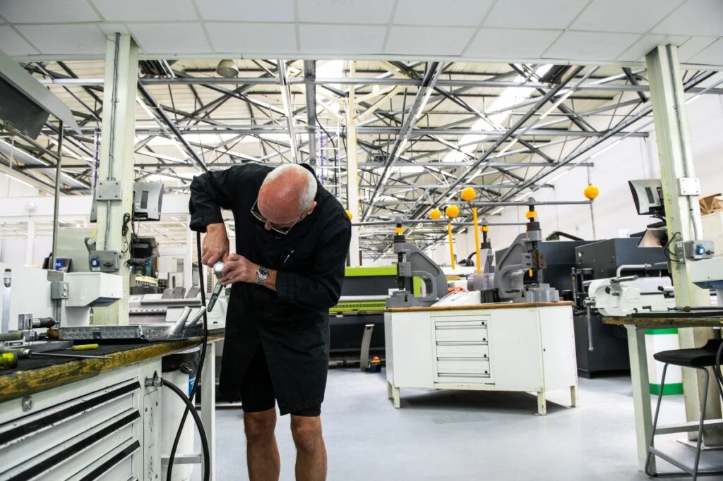 Race car parts are hand-crafted at a Formula One manufacturing plant.