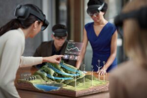 Group of government utility workers using Microsoft HoloLens 2 to collaborate on a wind farm development project.
