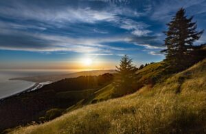 Expansive view of ocean coast at sunset across the foothills in Mount Tamalpais State Park, Mill Valley, California