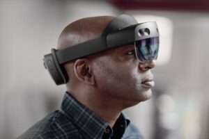 Man using Microsoft HoloLens 2.