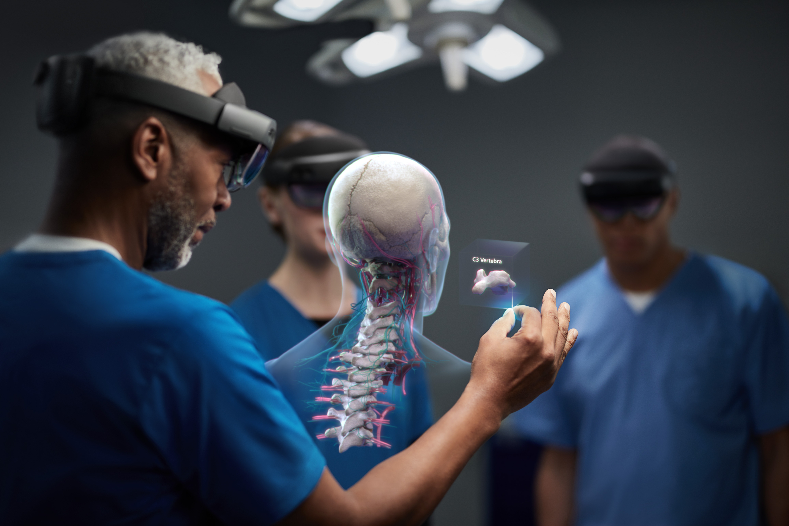 Surgeon and medical team, using HoloLens 2 to assist in an operating theatre.