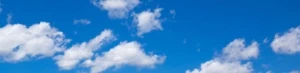 a cloud in a blue cloudy sky