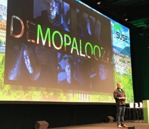 Michael Miller on stage, kicking off Demopalooza at SUSECON