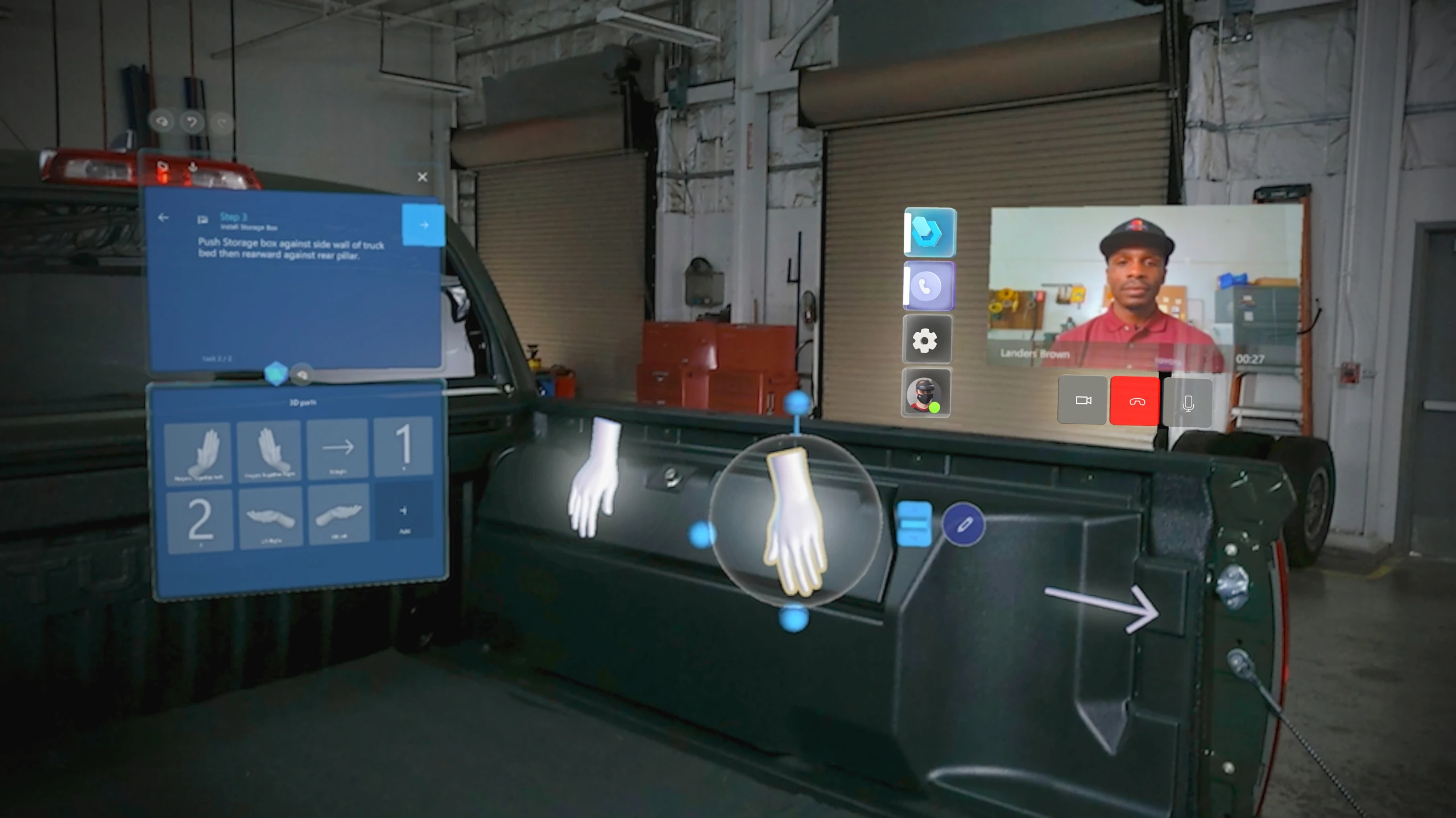 A user’s mixed reality view from their HoloLens, showing work instructions on a vehicle with a holographic video call window for real-time discussion with a remote colleague.