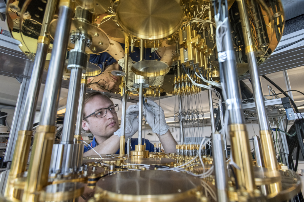 Researcher working on quantum hardware